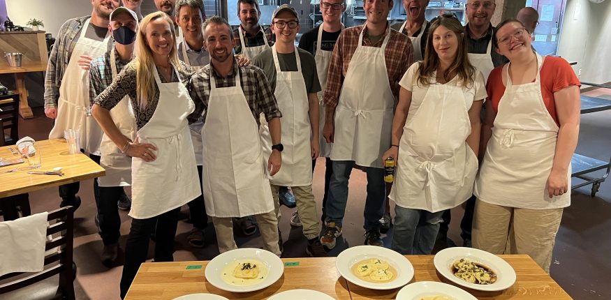 Insight team at cooking challenge from 2022 staff retreat